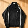adidas Originals Firebird Trainingsjacke High Collar – Schwarz / Weiß – Trefoil – Größe S