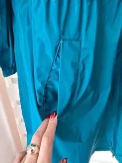 Nieuwe lange turquoise regenjas EU maat 52 54