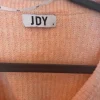 Rosa Strickjacke